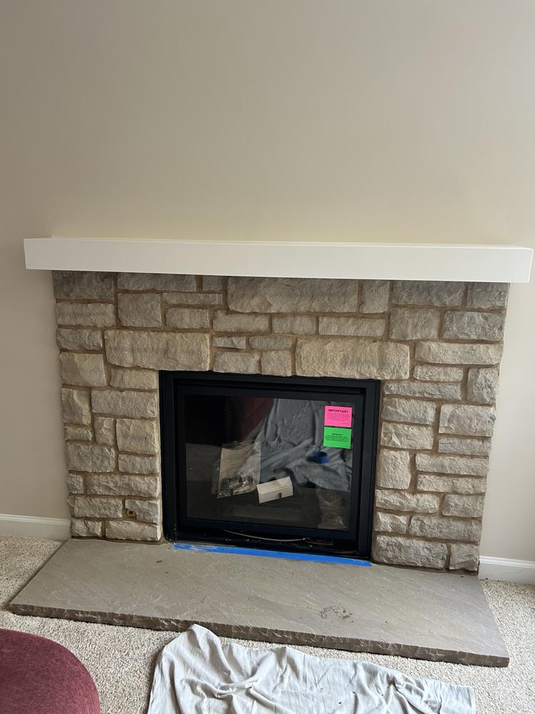 Stone fireplace completed